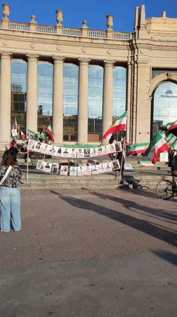 Protesters with Iranian flags gather at Fira Barcelona