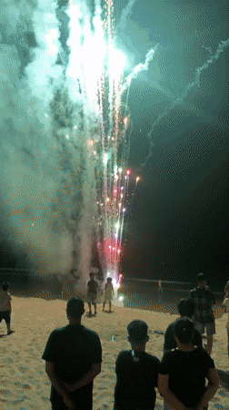 Beach bonfire and fireworks night in Phu Thuy Ward, Vietnam