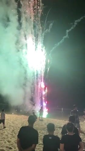 Beach bonfire and fireworks night in Phu Thuy Ward, Vietnam