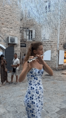 Summer afternoon foot traffic through Budva's Old Town.