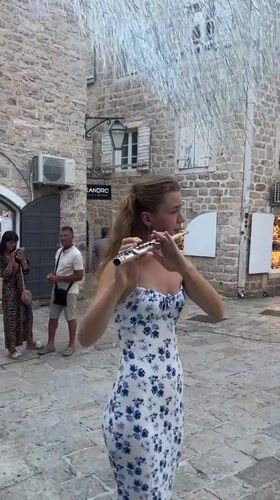 Summer afternoon foot traffic through Budva's Old Town.