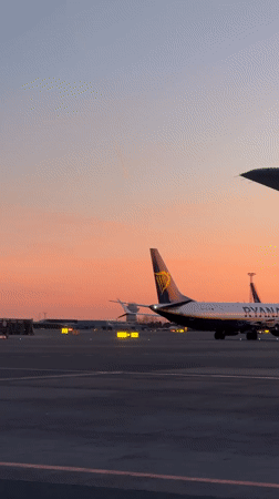 Sunset aircraft operations captured at Copenhagen Kastrup Airport