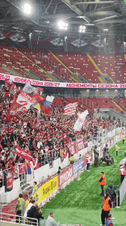 Match day in Khimki: stadium full, flags out, train ride included