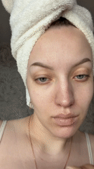 Woman performs morning skincare routine in Reshetnikovo, Russia