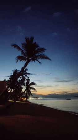 Dusk beach scene documented in Baan Mae Nam, Thailand