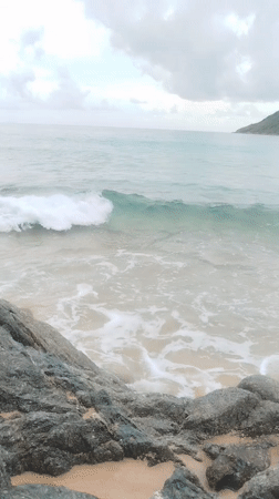 Casual morning at Rawai beach, rocky shores and overcast skies