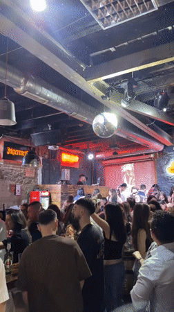 Nightclub scene captured in Plovdiv with DJ and dancing crowds