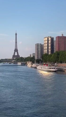 Eiffel Tower and Seine River on a clear Paris afternoon