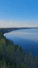 Woman poses for photos at scenic Kostovaty overlook in Russia