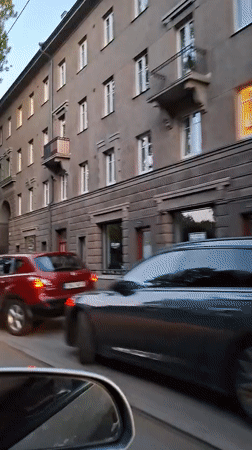 Evening drive-by footage captures routine Tallinn street scenes