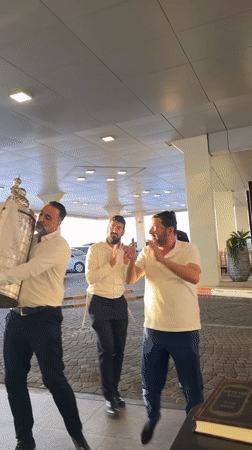 Torah scroll celebration outside a Tel Aviv building