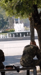 Military band at rest in a Pleven park with instruments