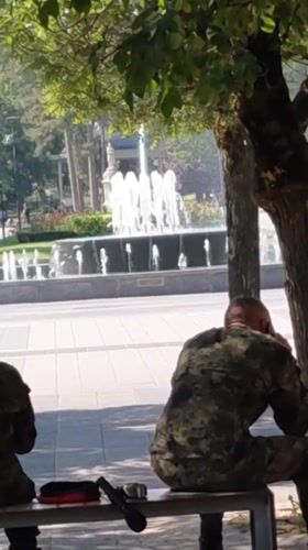 Military band at rest in a Pleven park with instruments