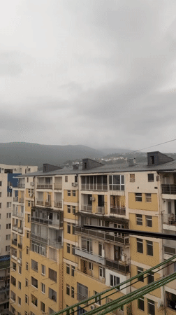 Balcony hangout and city views from a Tbilisi high-rise