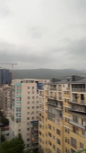Balcony hangout and city views from a Tbilisi high-rise