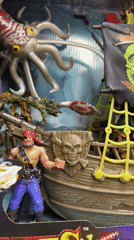 Shopper documents toy displays in Buenos Aires store aisle