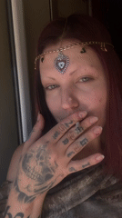 Woman in decorative headpiece filmed drinking, smoking in Montenegro village