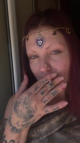 Woman in decorative headpiece filmed drinking, smoking in Montenegro village
