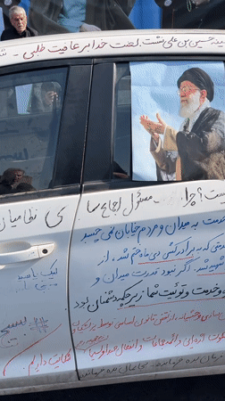 White car turned message board spotted on Tehran streets