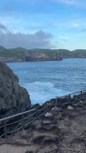 Tourists visit Angel's Billabong natural pool in Nusa Penida