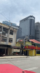 Early morning street life and breakfast documented in Kuala Lumpur