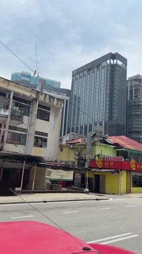 Early morning street life and breakfast documented in Kuala Lumpur