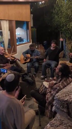 Musical jam session draws group to outdoor patio in Haini