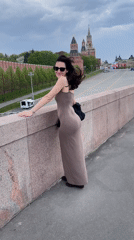 Woman in brown dress spotted on Moscow bridge near Kremlin