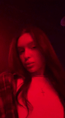 Woman filmed in colored lighting in Moscow