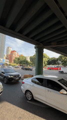 Traffic flows beneath green bridge in Buenos Aires