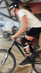 BMX riding through an indoor wooden skatepark in Bluewater