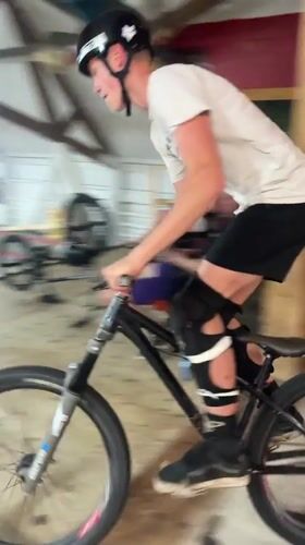 BMX riding through an indoor wooden skatepark in Bluewater