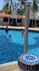 Resort guests play pool volleyball in Porlamar, Venezuela