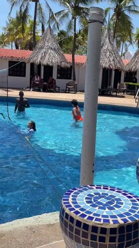 Resort guests play pool volleyball in Porlamar, Venezuela