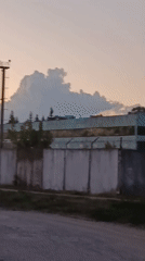 Dusk sweep of a fenced industrial complex in Svietlahorsk, Belarus
