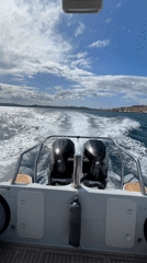 Motorboat with twin Mercury engines cruises La Maddalena waters