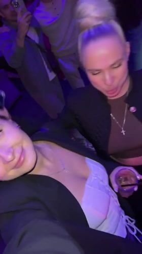 Two women sing along to music at Odintsovo nightclub