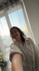 Woman and Siamese cat captured in domestic afternoon scenes