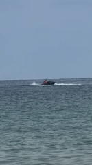 A busy morning on Sozopol's beach: water sports and sunbathing