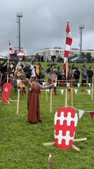 Medieval reenactment event features archery and sword fighting in Russia