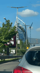 Morning glimpses of Sofia skyscraper construction from passing vehicles
