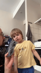 Man and child operate drone together in Riga