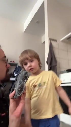 Man and child operate drone together in Riga