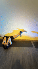 Morning yoga session with wall stretches captured in studio