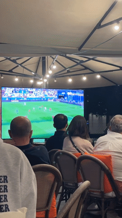 Budapest crowd watches live soccer match on outdoor screen