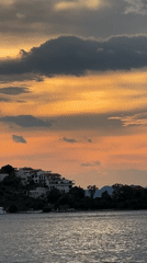 Evening life unfolds along Fethiye's waterfront during sunset hour
