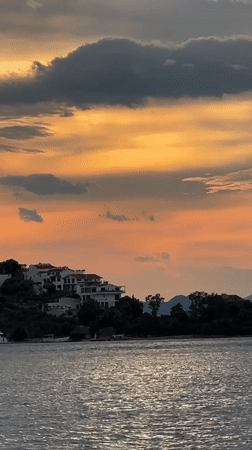 Evening life unfolds along Fethiye's waterfront during sunset hour