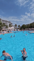 Crowded outdoor pool on a sunny day in Sochi