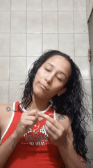 Woman's evening skincare routine recorded in Porlamar bathroom