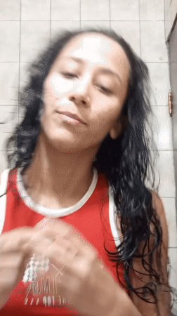 Woman's evening skincare routine recorded in Porlamar bathroom